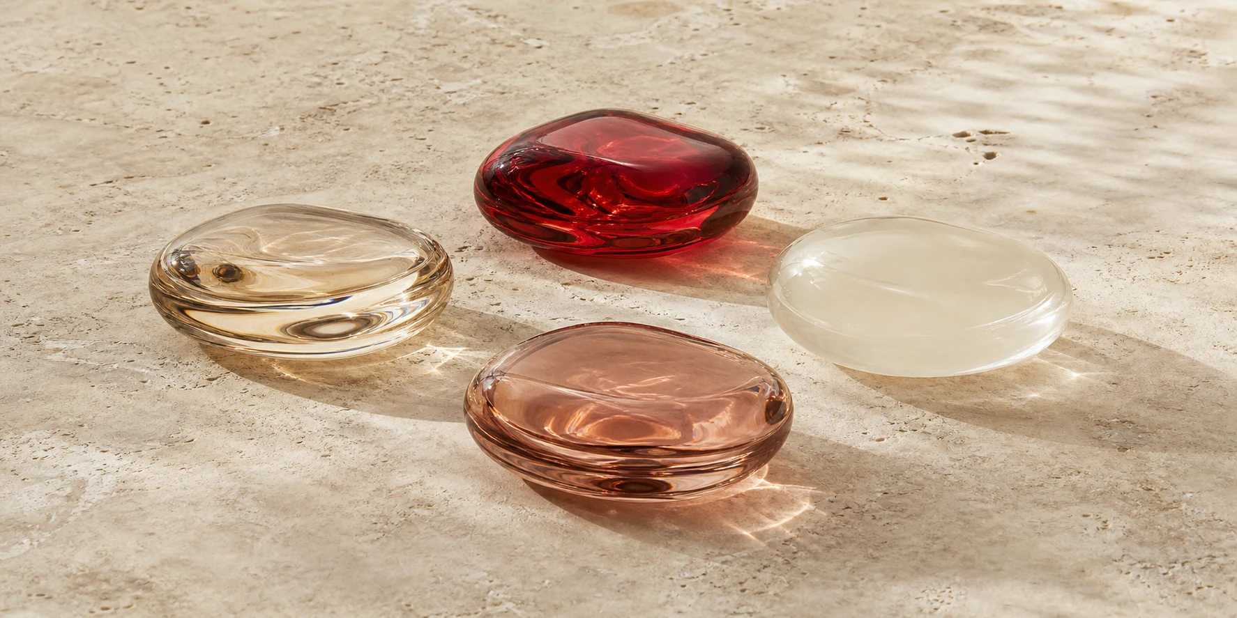 Four equal ivory, ruby and champagne glass forms representing the verified Repagen Exclusive catalogue scope.
