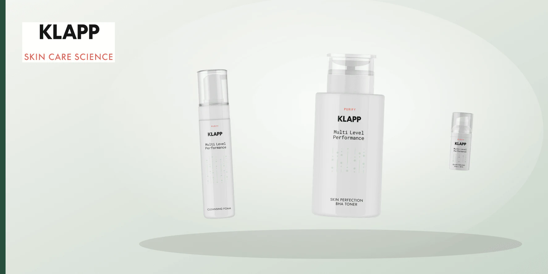 An ivory, clear glass and muted plum cosmetic-routine still life representing the KLAPP Purify range.